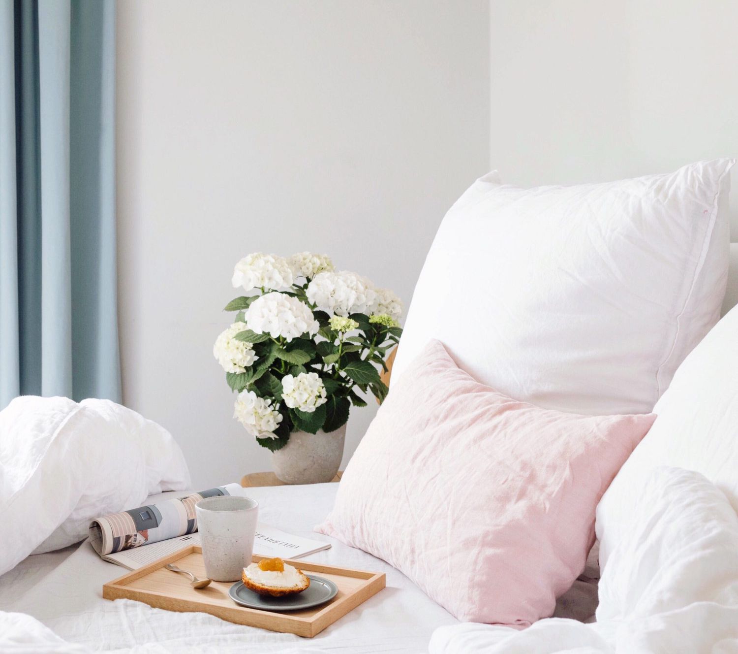 Pretty Bed with Flowers and a Breakfast Tray