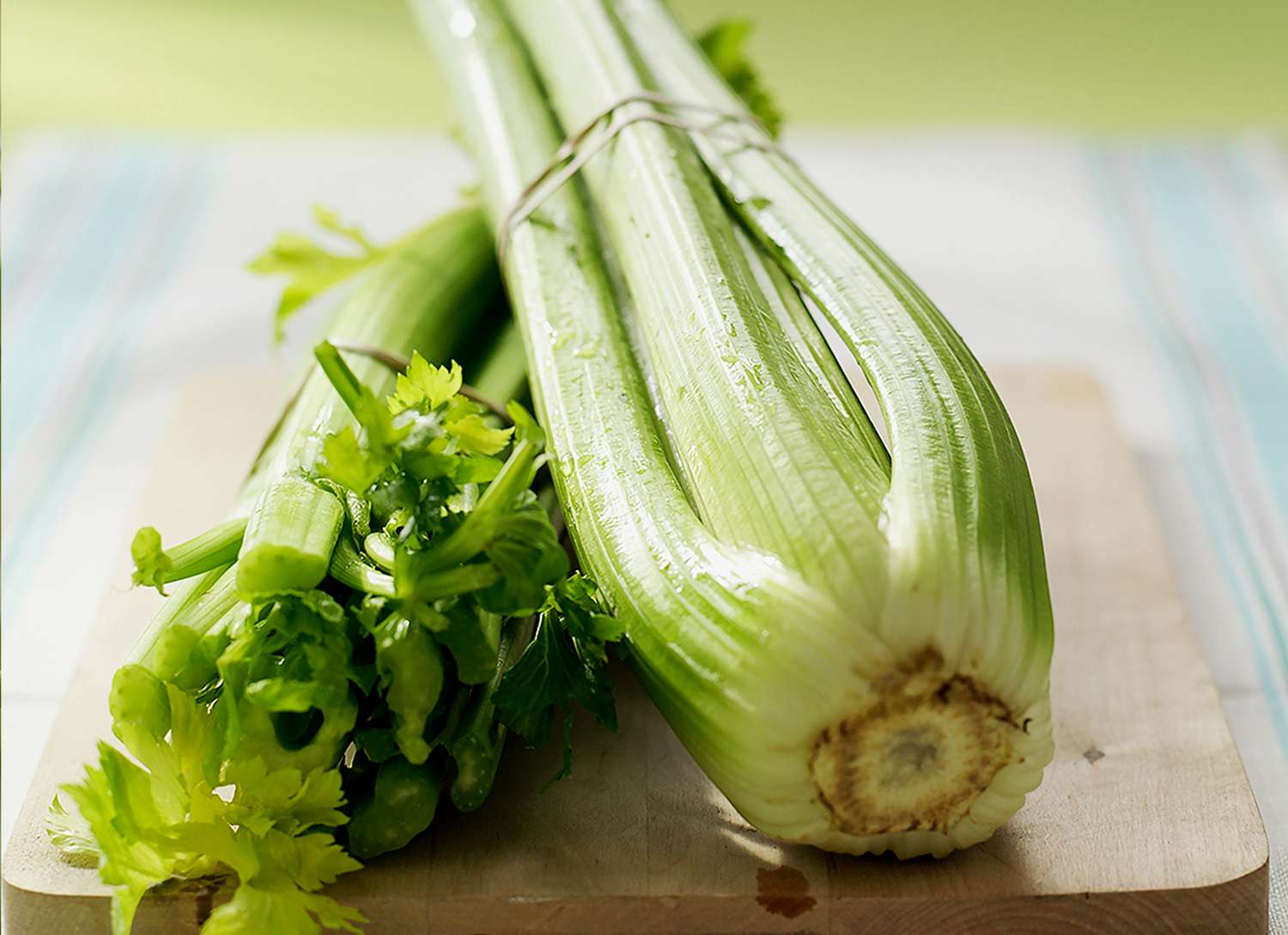 celery on a wooden cutting board
