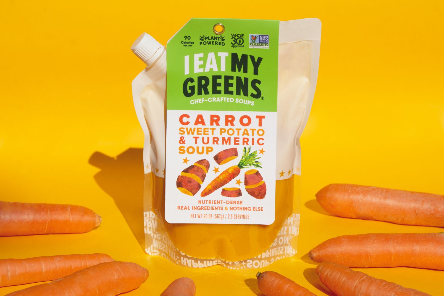 package of carrot turmeric soup and raw carrots