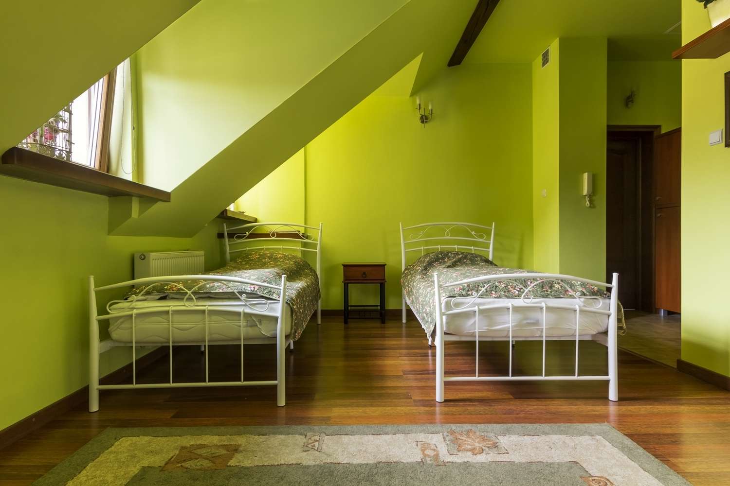 Two beds in the green room in the attic