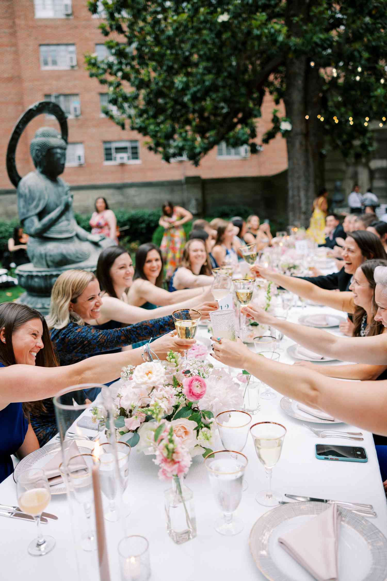 Wedding toast at long table outside