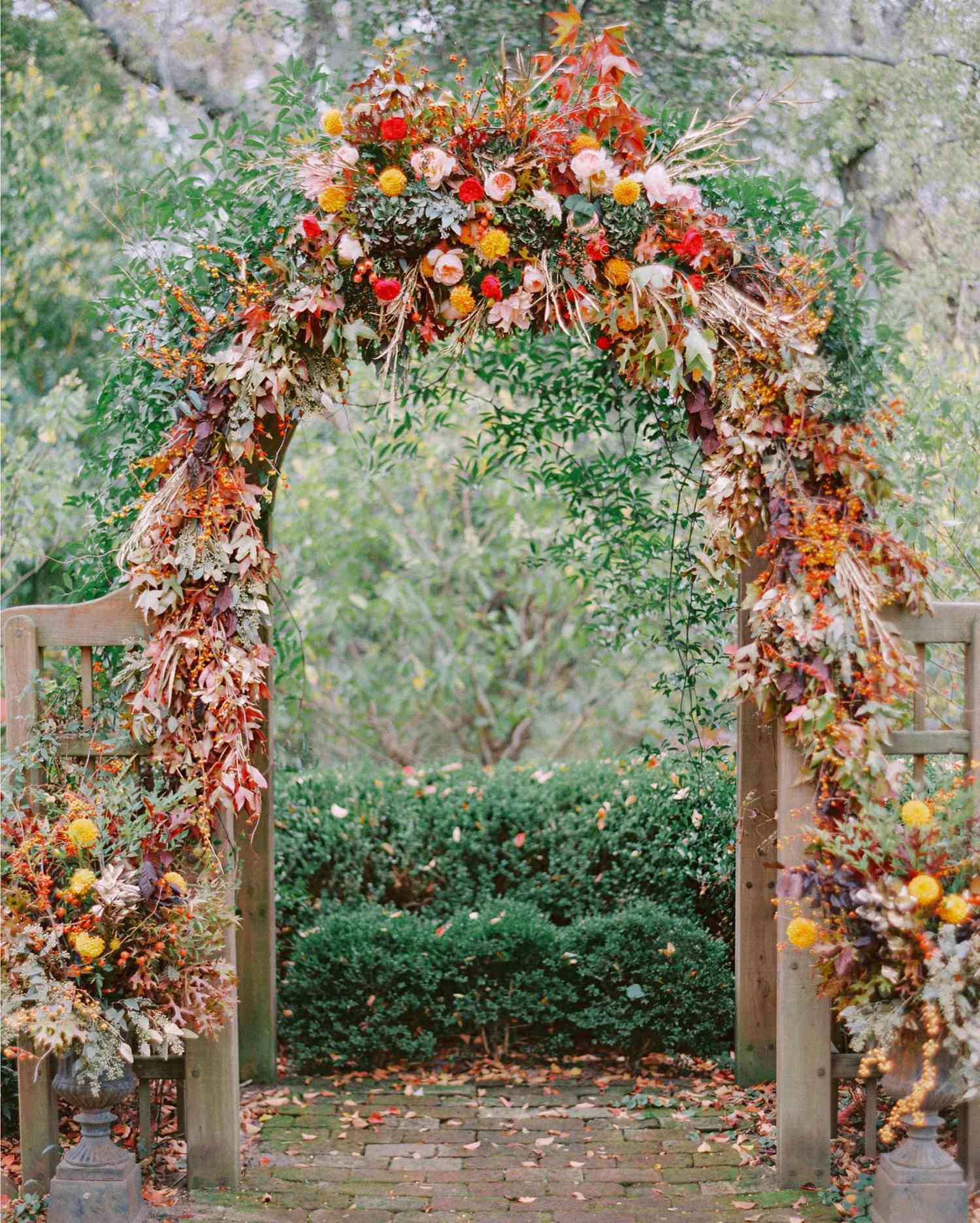 Unkempt Willow Branch Wedding Arch with Pink and Orange Flowers