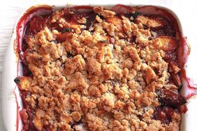 close up of peach crumble in white dish