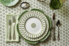 A table setting with patterned plates cutlery and a napkin
