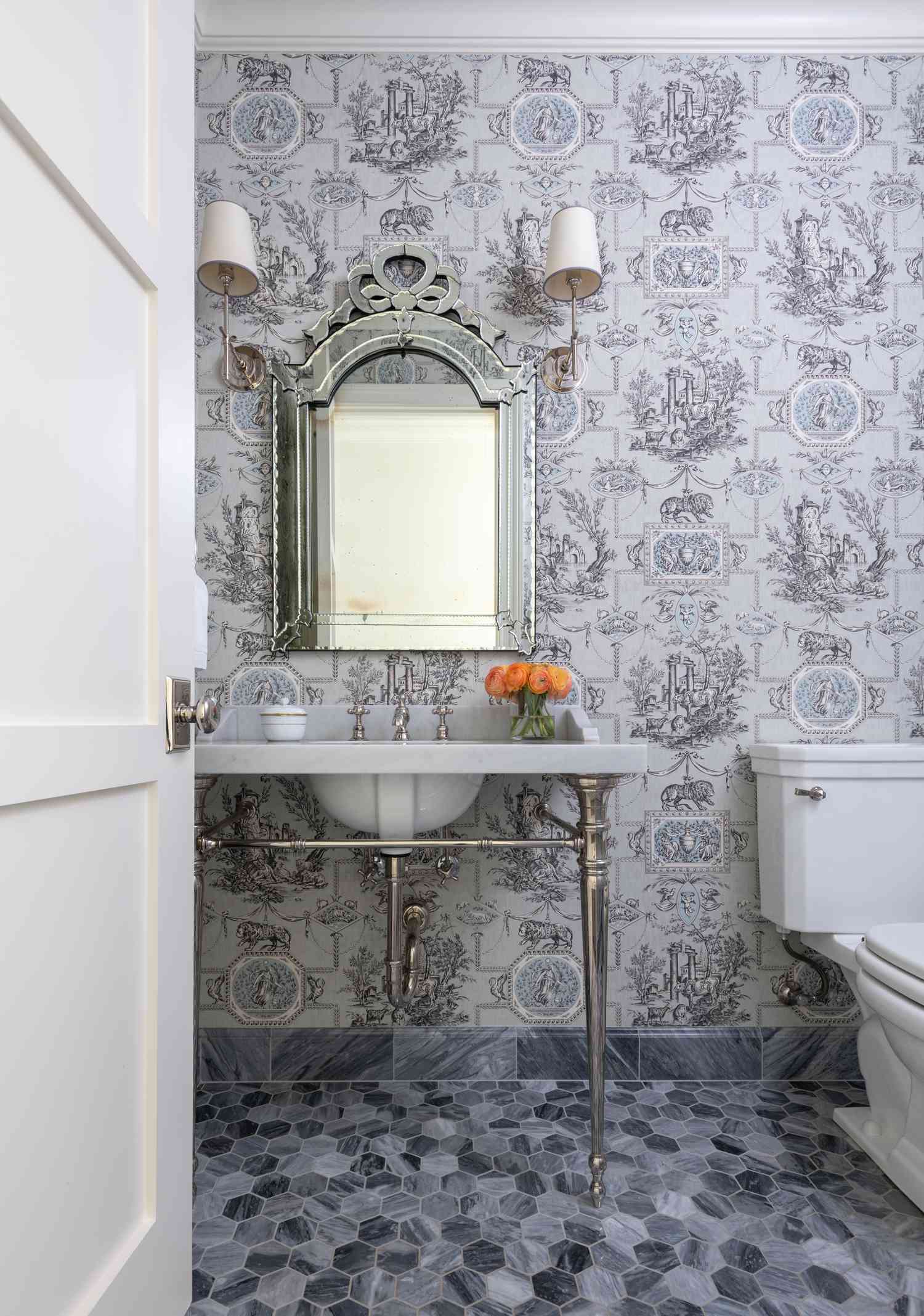 a bathroom with wallpaper and tile
