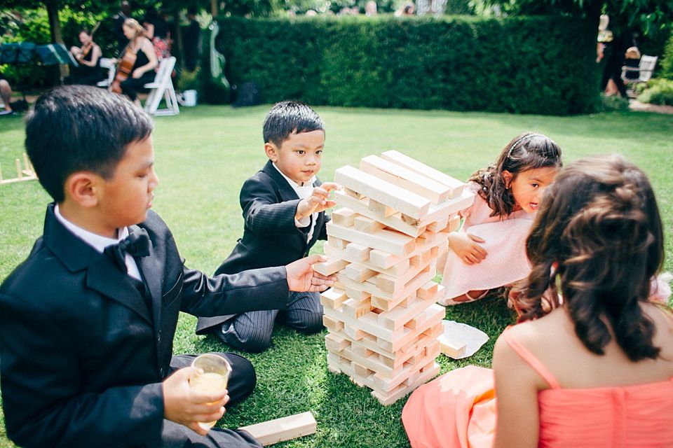 kids playing jenga at wedding