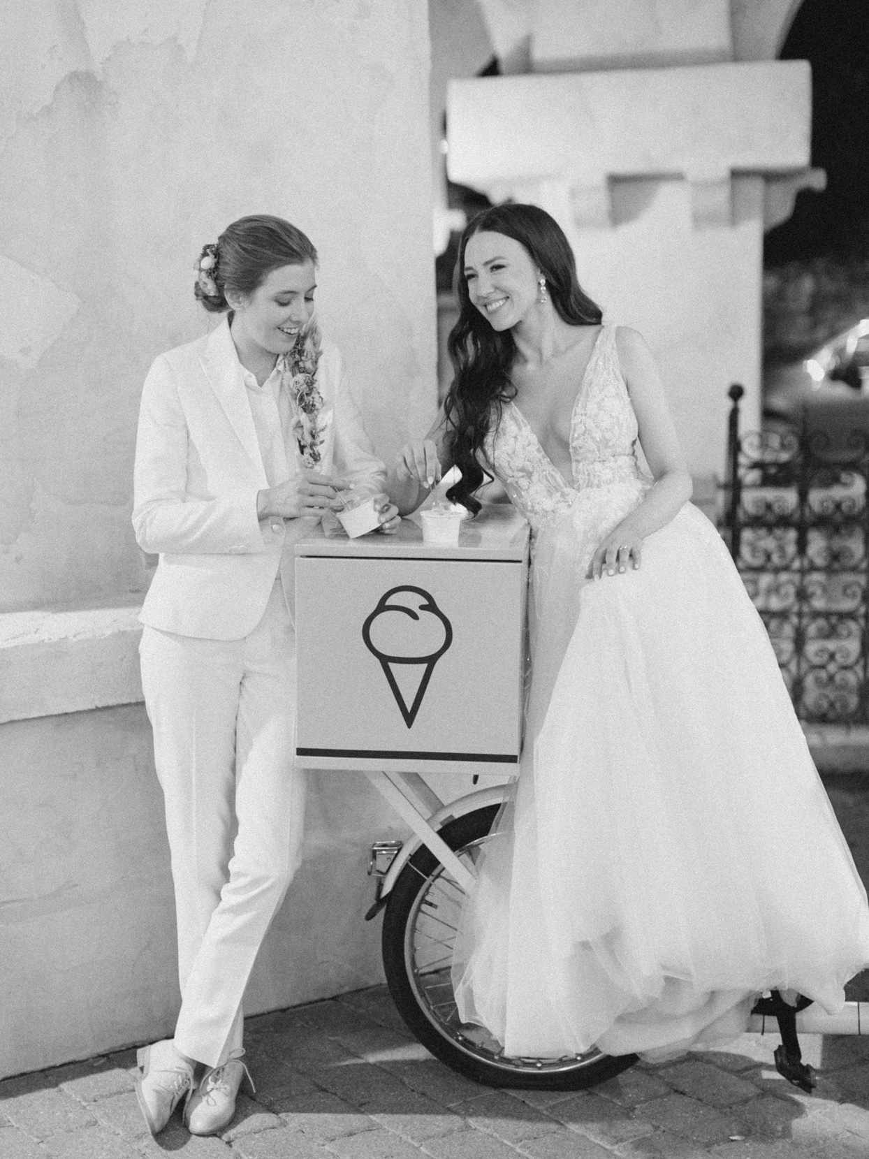 couple portrait eating gelato on bike