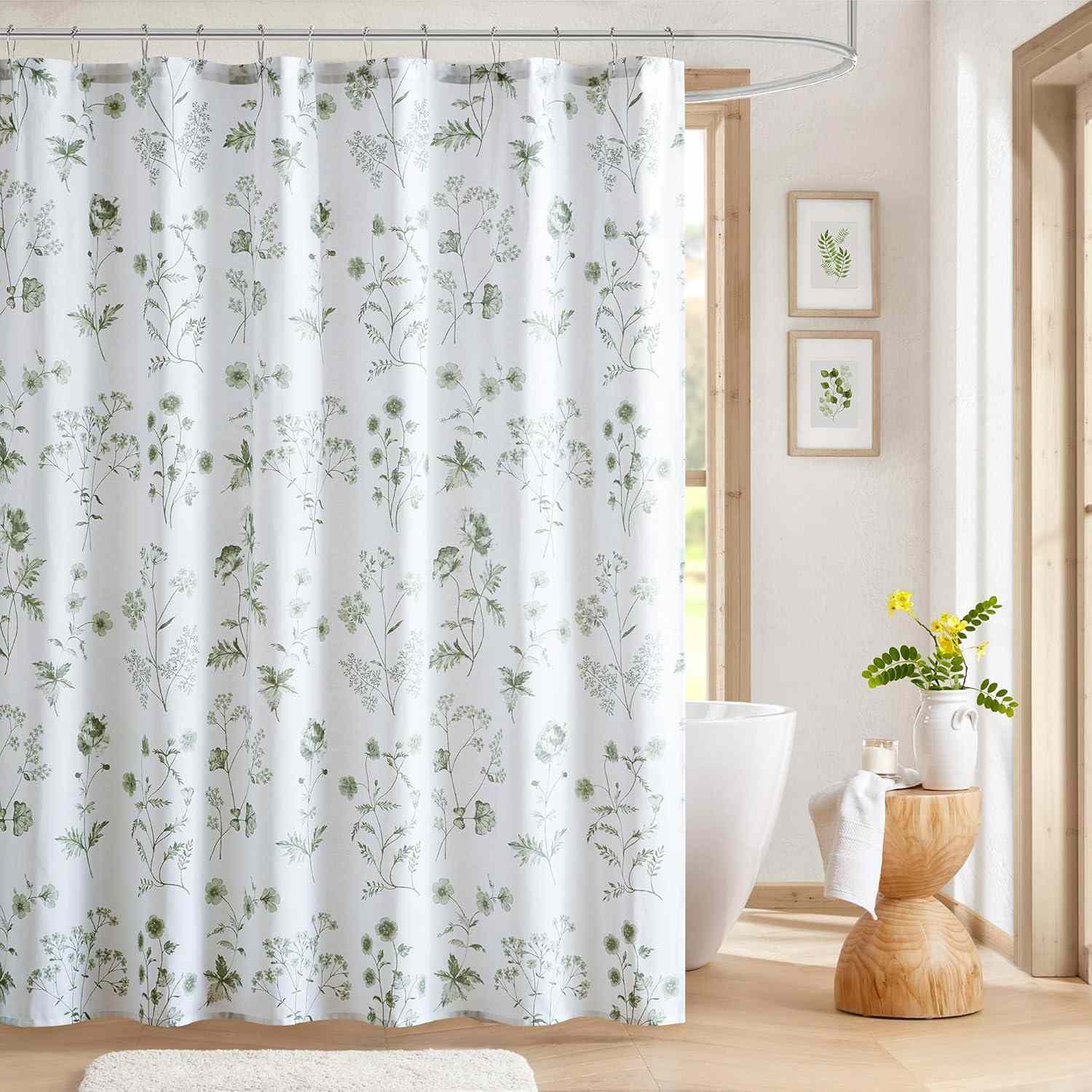 Bathroom with a shower curtain featuring a floral pattern a wooden stool with a plant vase and daylight streaming through windows