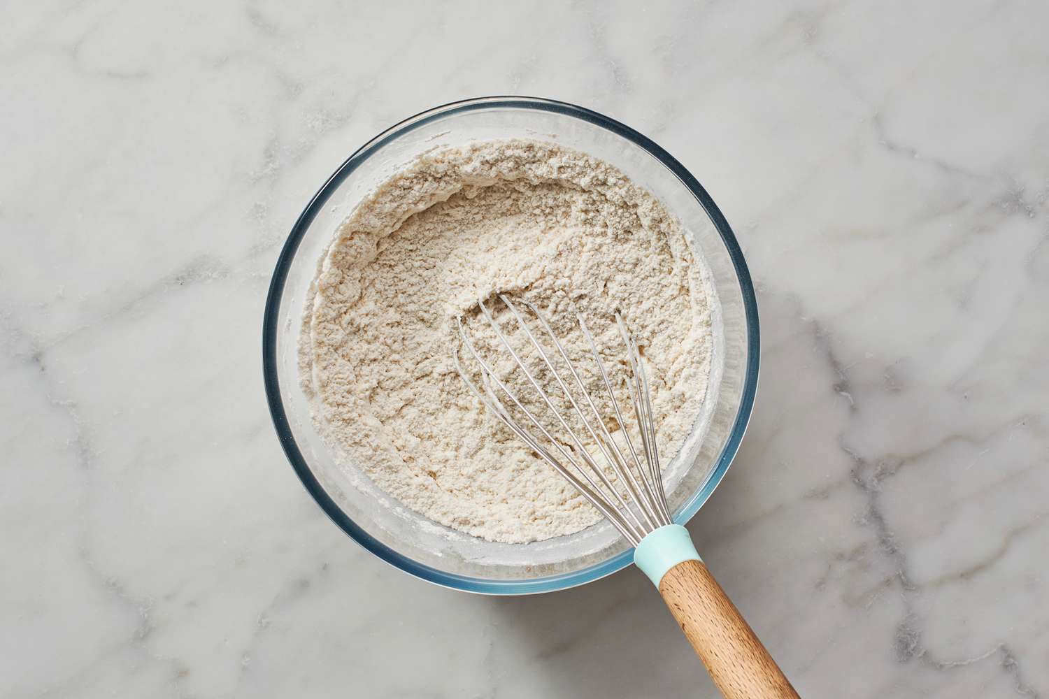whisking flour in mixing bowl