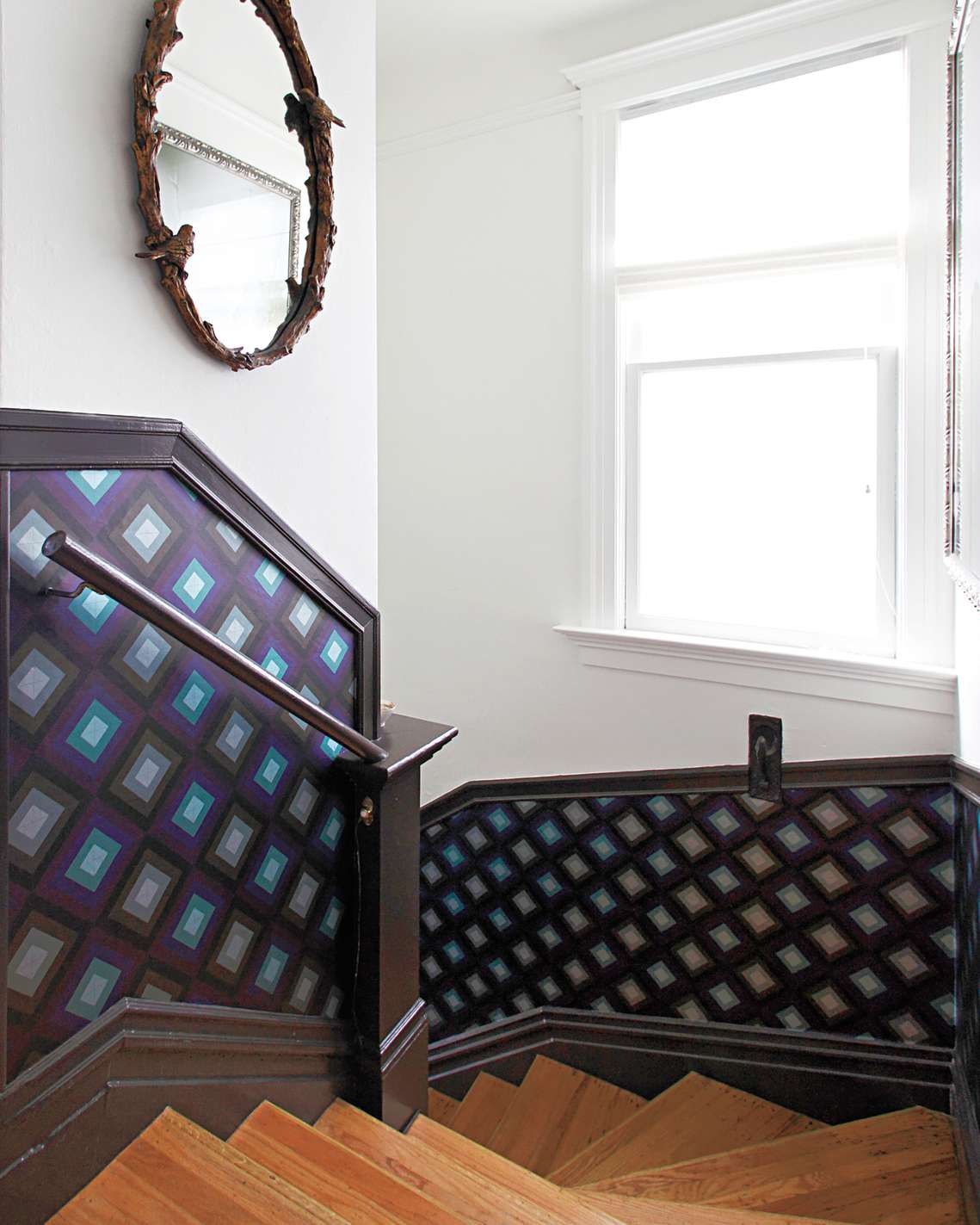 Staircase with purple wallpaper