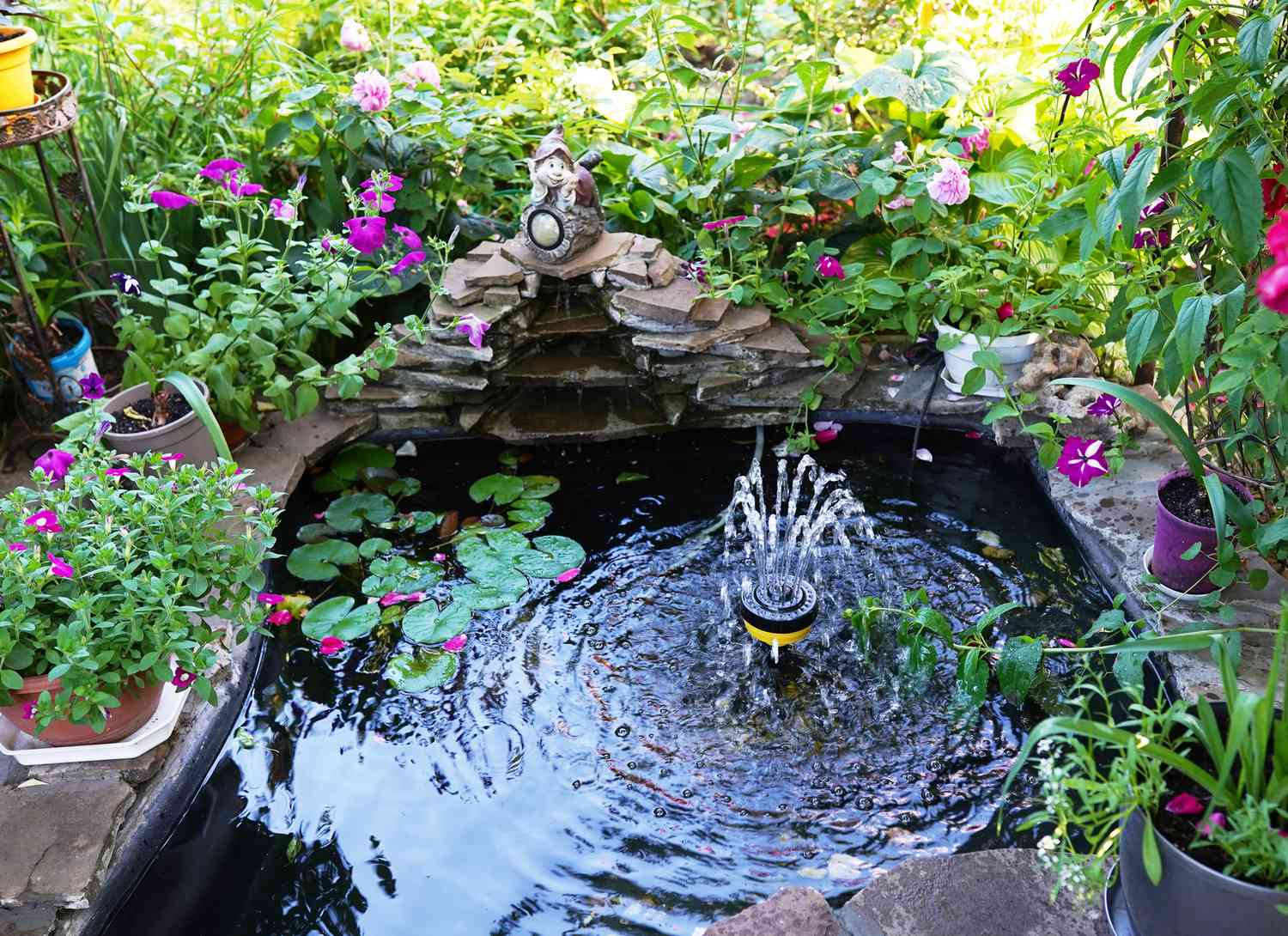 water fountain in a koi pond