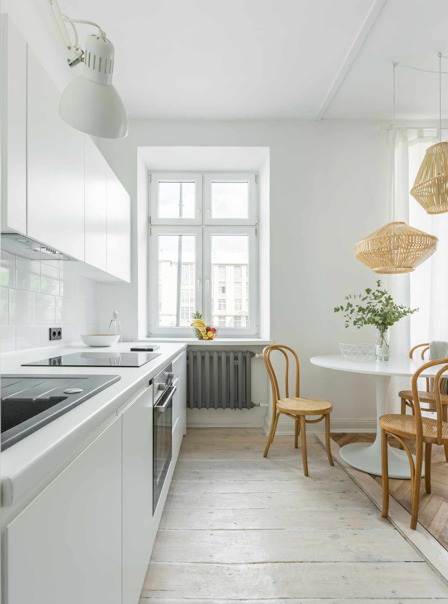 Dining room/kitchen with whitewashed floors