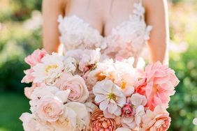 peony bouquets muted pink-and-white peonies, roses, and cosmos to mimic the fluffy dress bodice