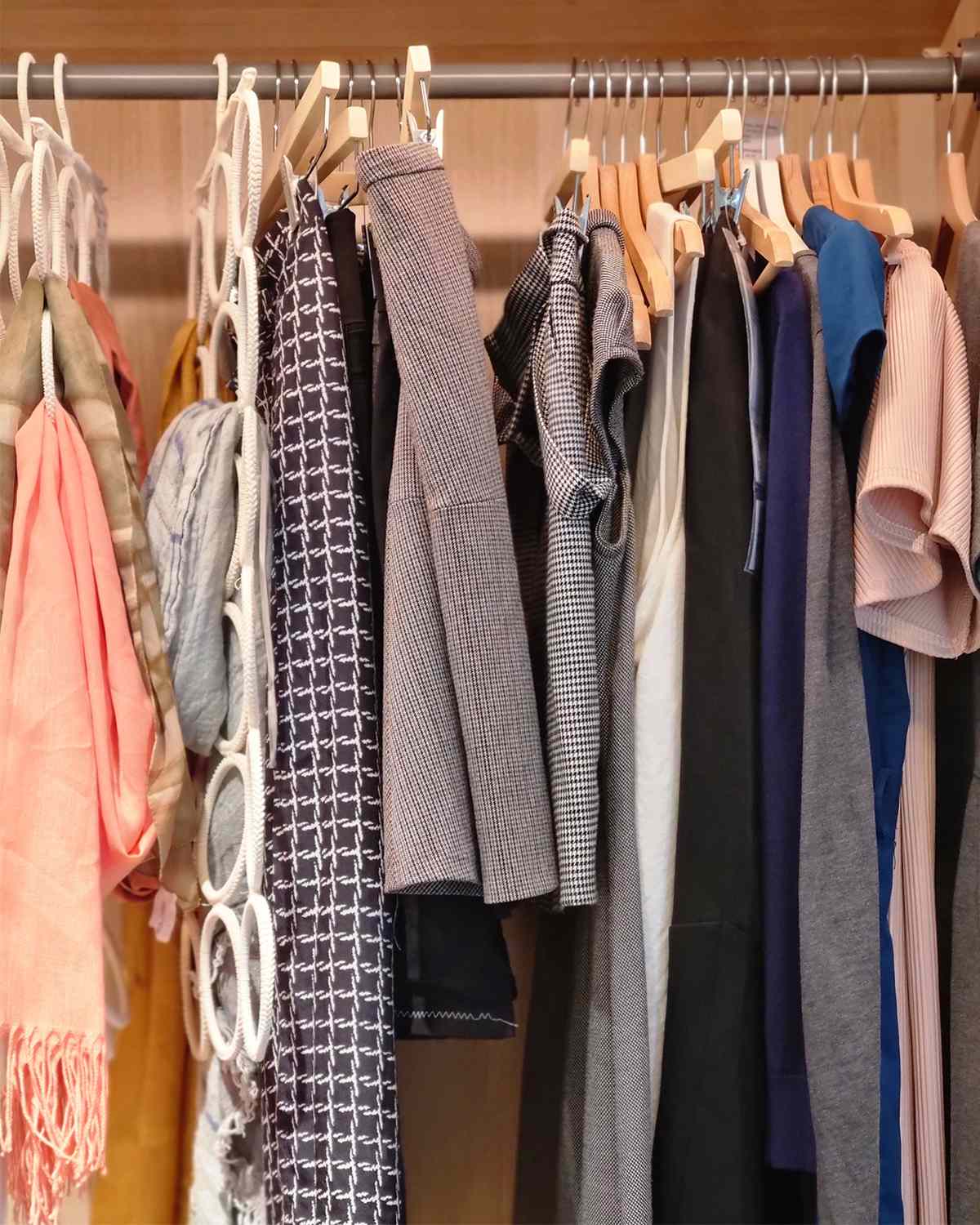 A collection of clothes and accessories organized in a closet