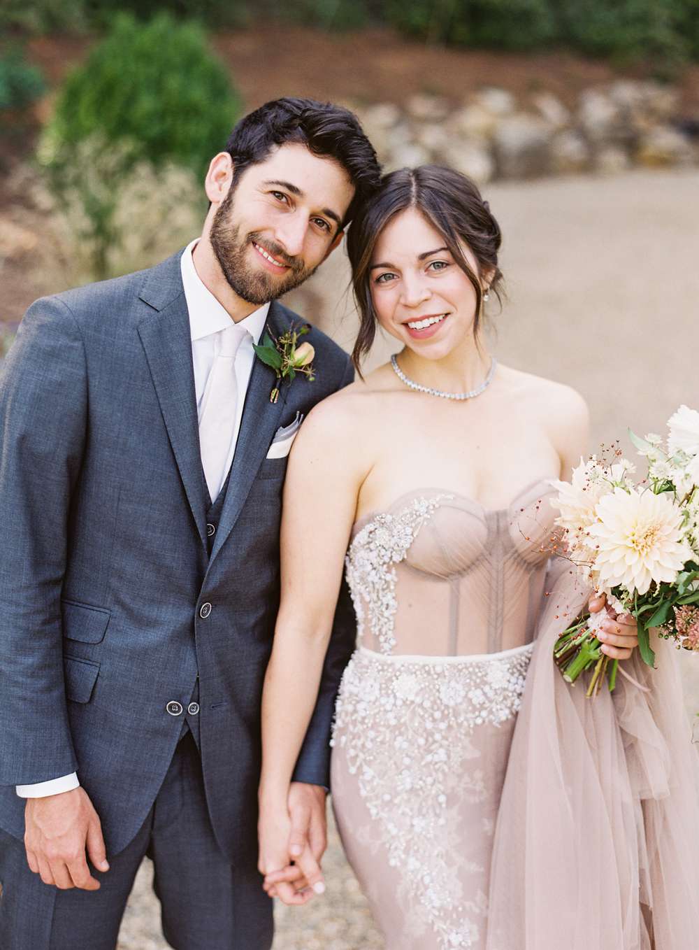 beth aaron holding hands smiling