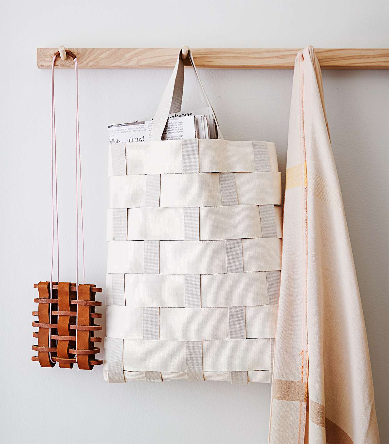 woven tote bags hanging on the wall