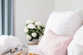 Pretty Bed with Flowers and a Breakfast Tray