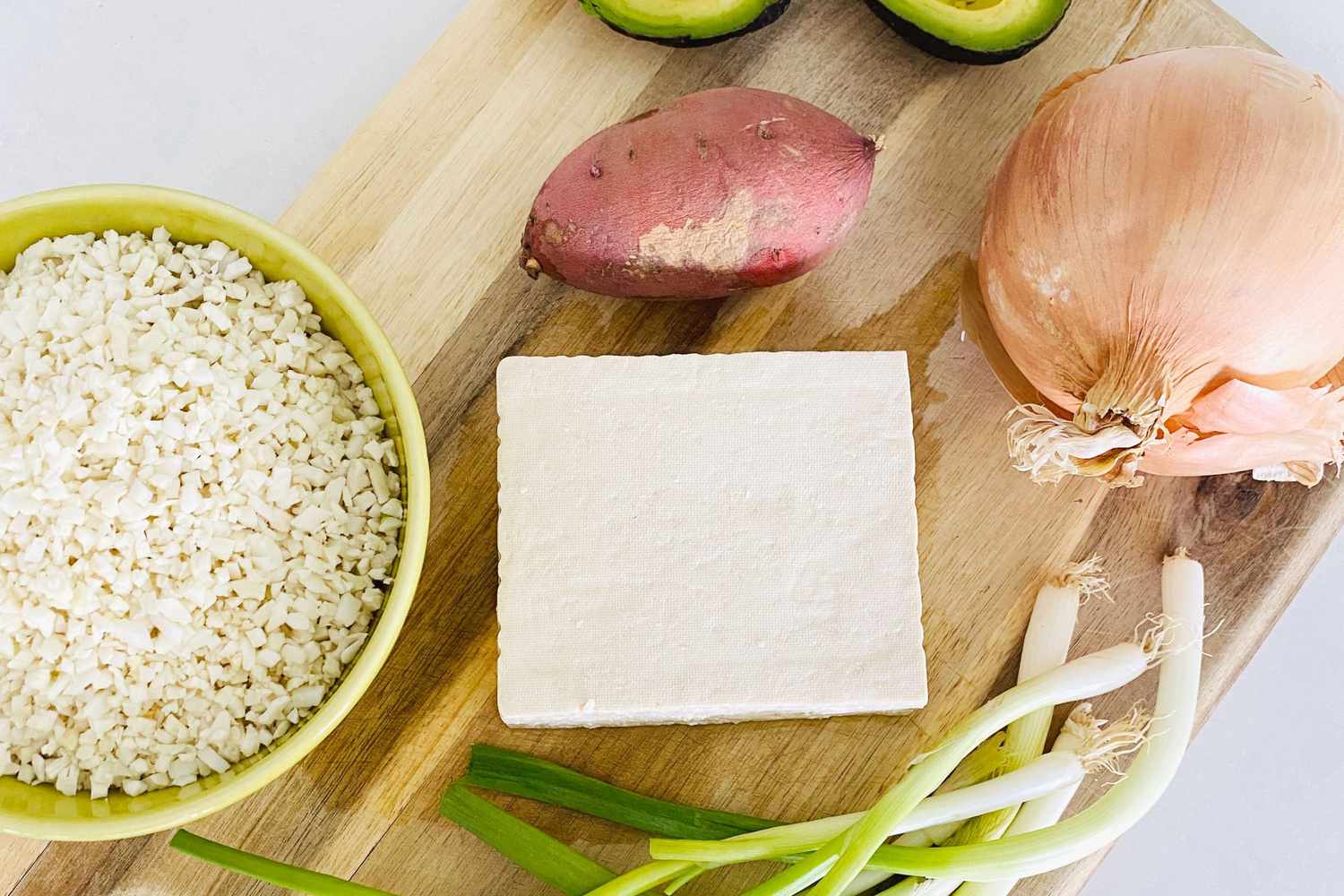 tofu block on wood cutting board