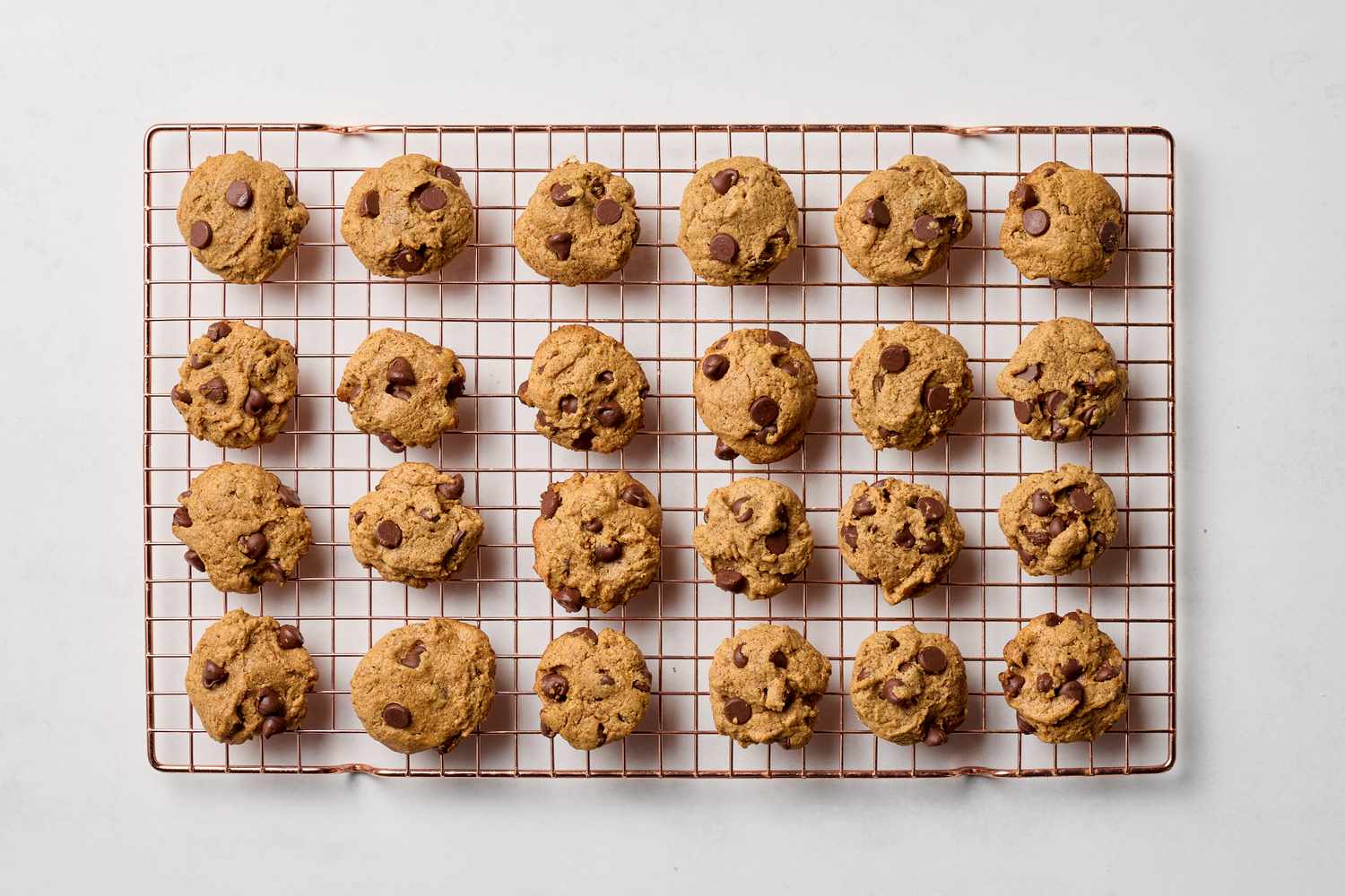 Chocolate chip cookies on a wire cooling rack