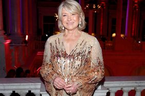 decorvow dressed in a gown, standing at an event