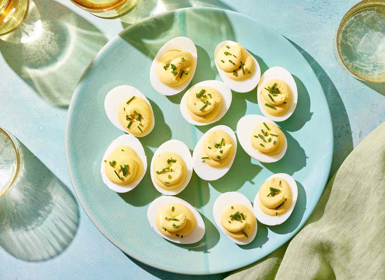 overhead view of hard boil eggs on a blue plate