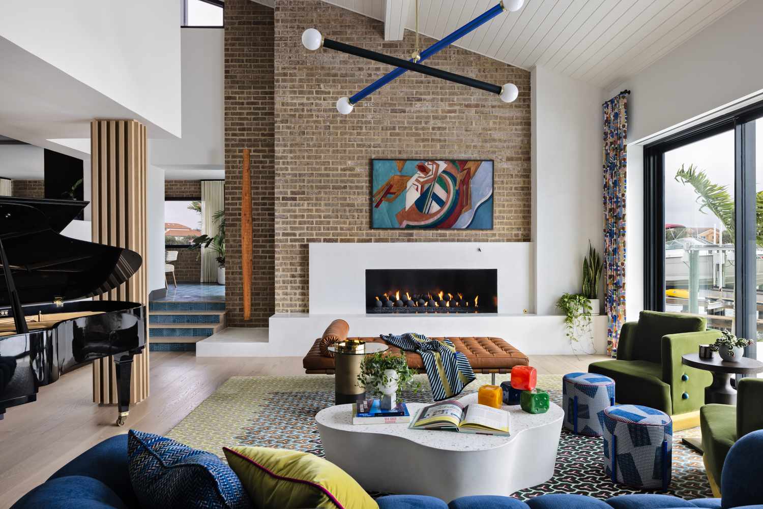 Contemporary living room with a fireplace artwork and eclectic furniture arrangement
