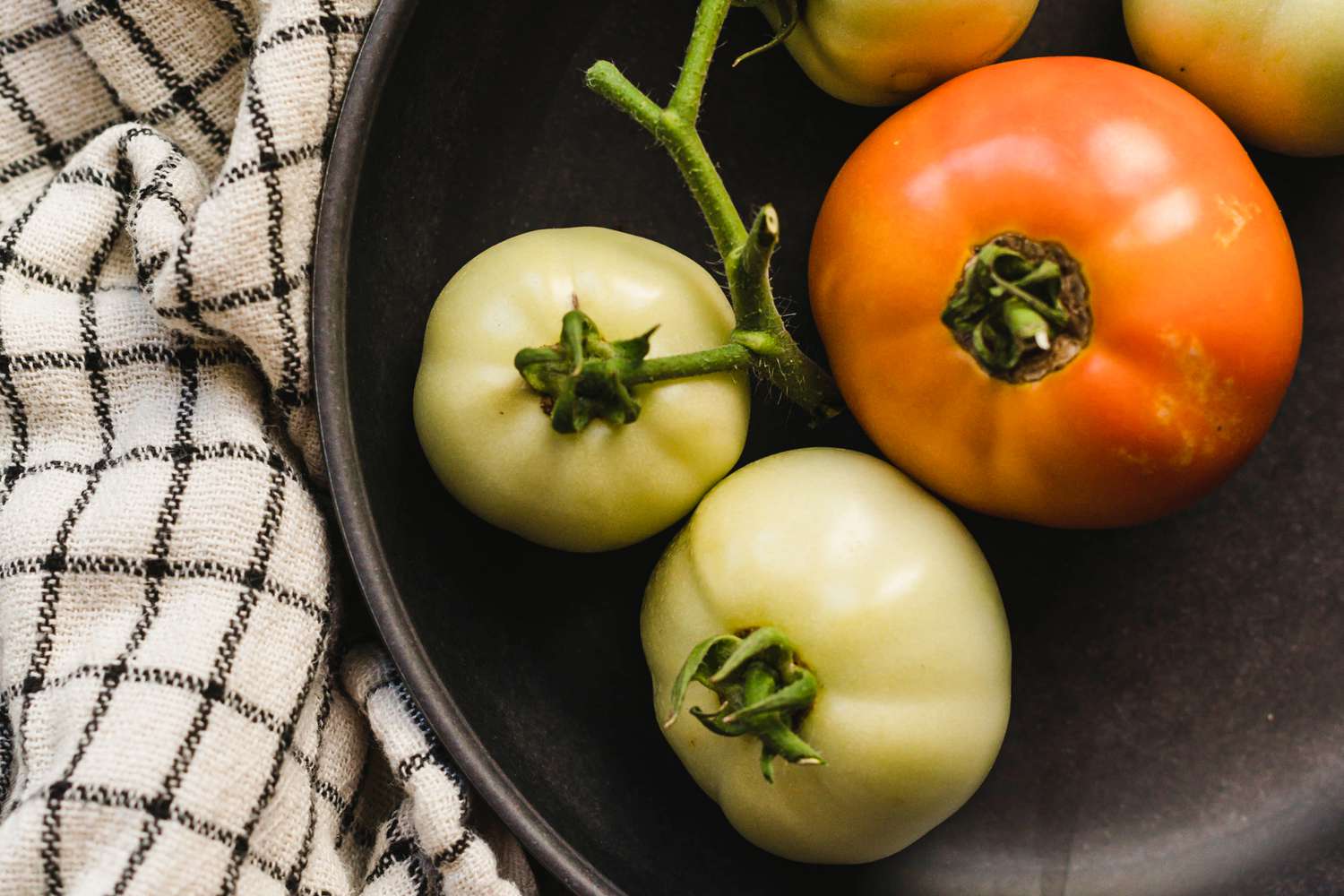 tomatoes ripening in bowl 
