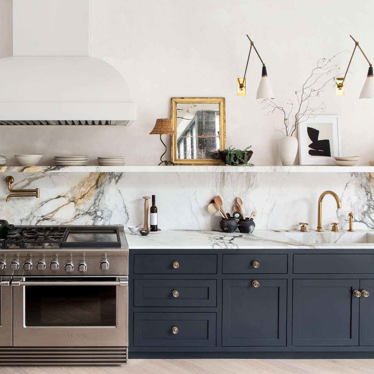 marble backsplash navy cabinets