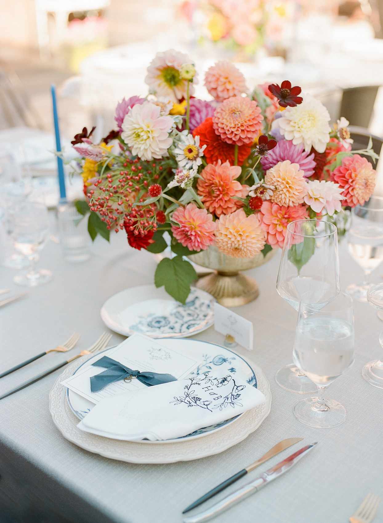 floral bouquet centerpieces with white and navy place settings