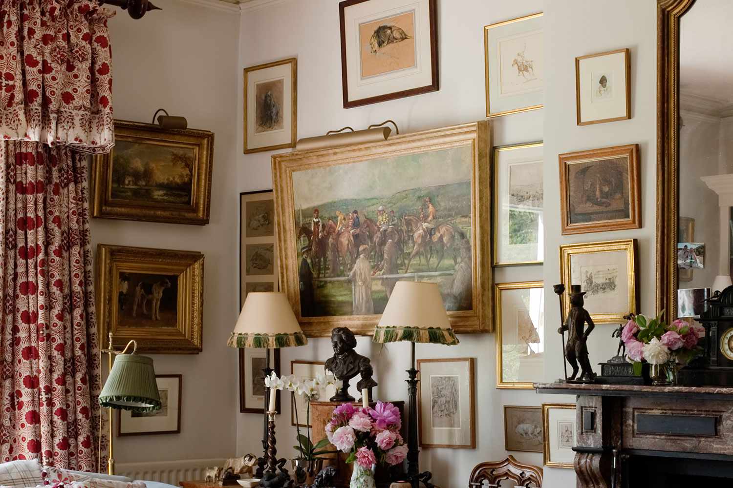 Living room with gold framed oil paintings