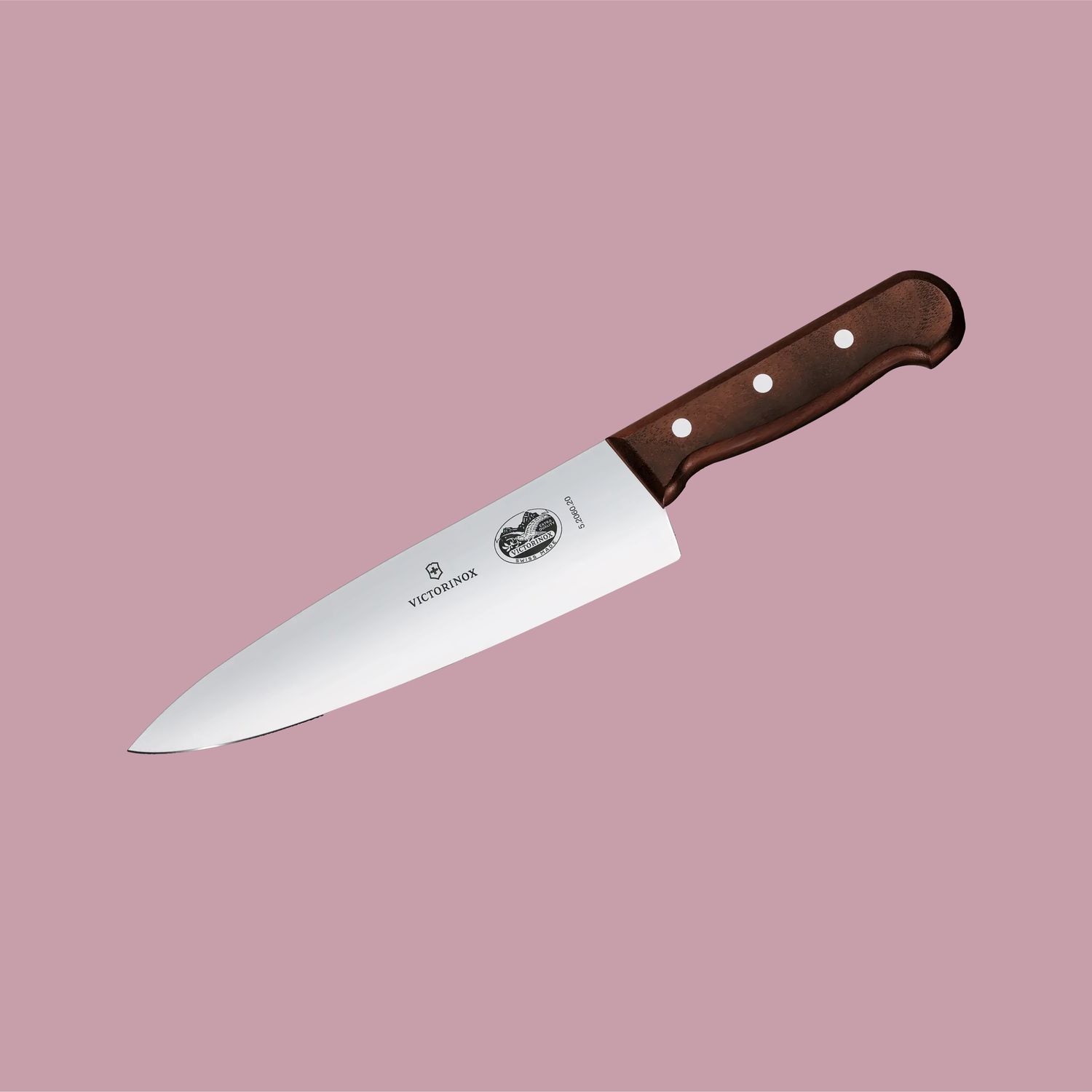 chefs knife on a pink background