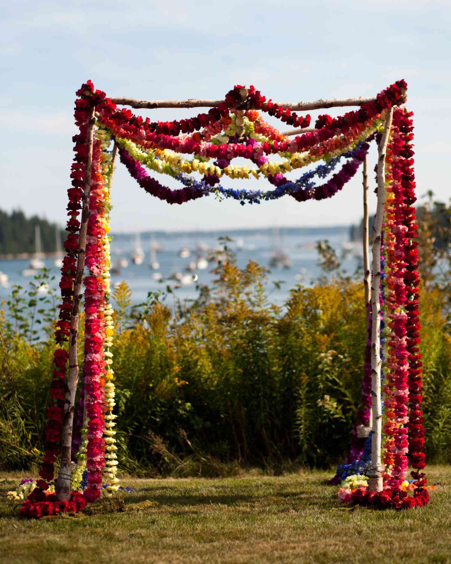 Unkempt Willow Branch Wedding Arch with Pink and Orange Flowers