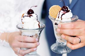 bride and groom each holding an ice cream sundae