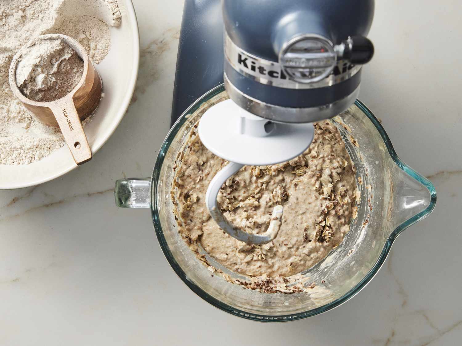 Ingredients for multigrain bread in bowl under stand mixer