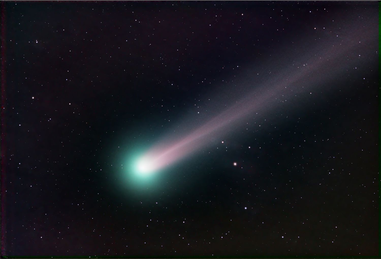 Green comet in night sky