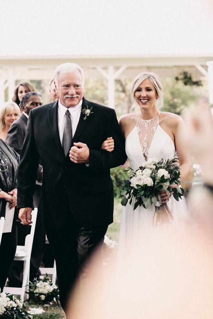 father of the bride wearing a black suit and charcoal gray tie