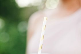 coffee wedding ideas woman holding iced beverage with couple names sleeve