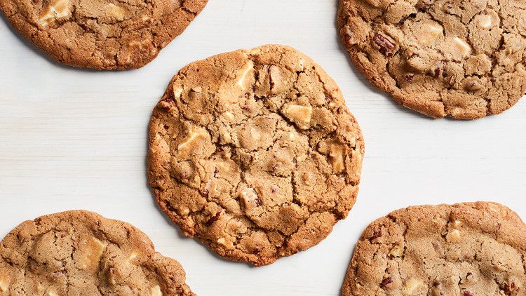 giant white-chocolate-pecan cookies against a white background