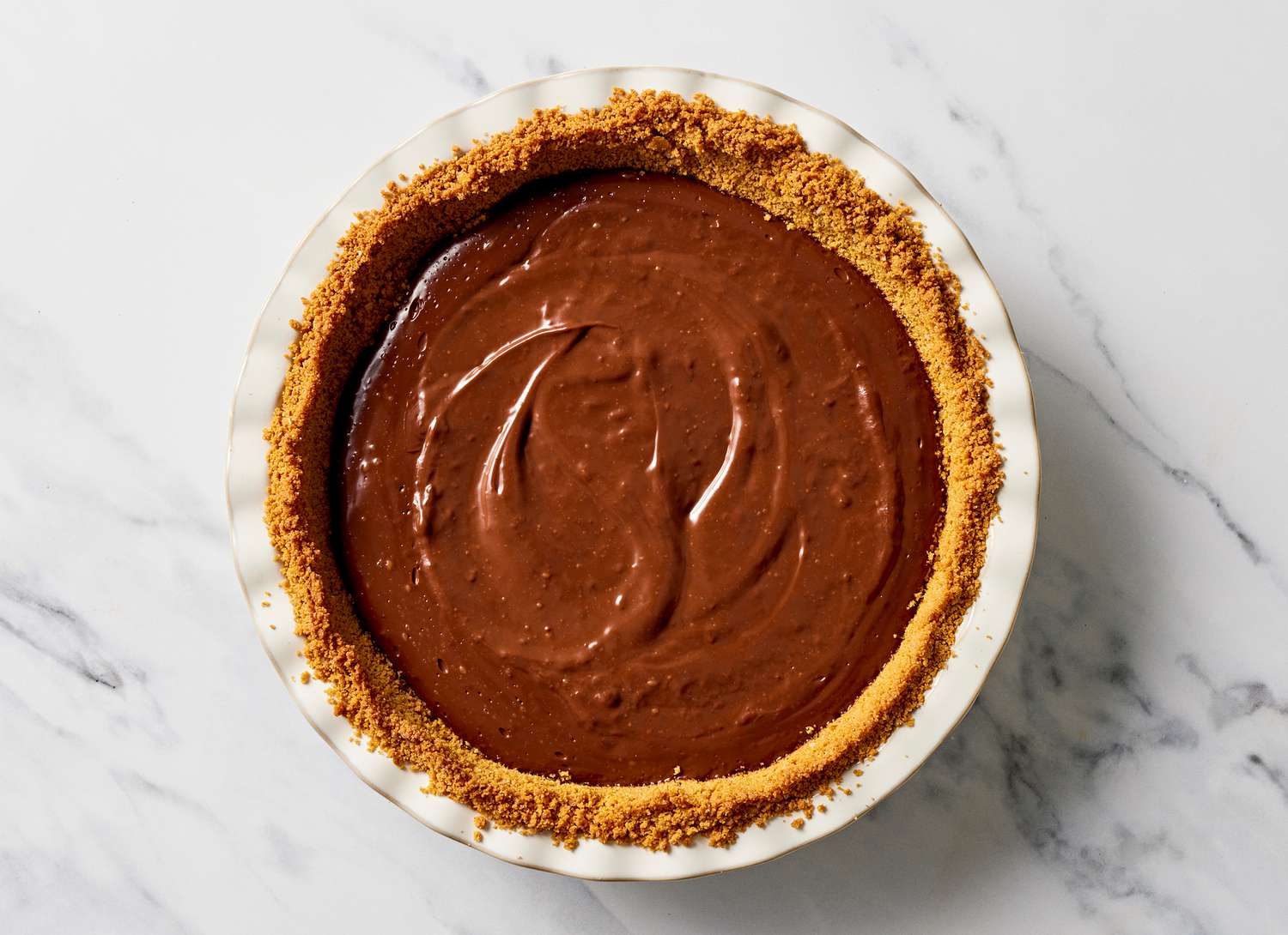 chocolate pie in a white pie dish