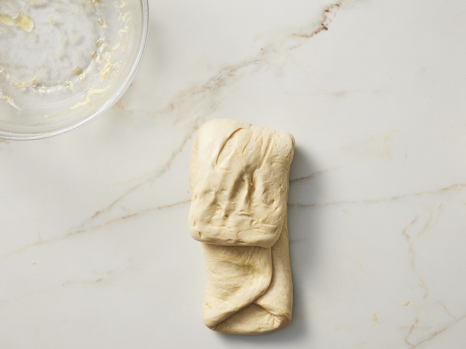 Folded dough on marble