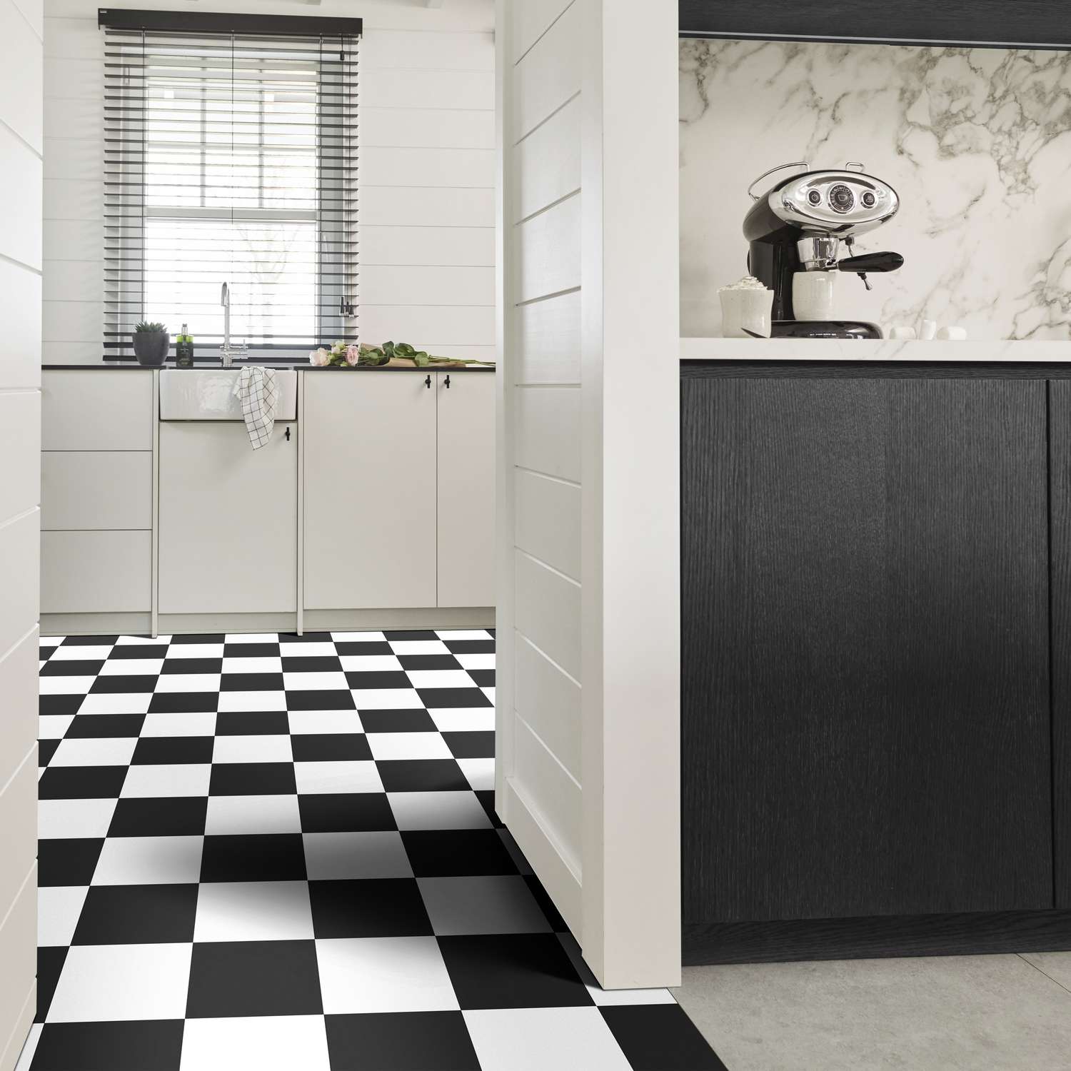 A kitchen with checker tiles