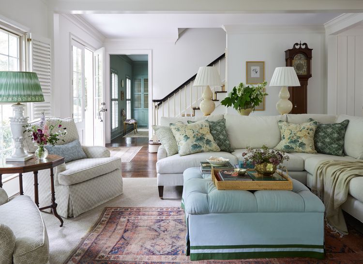 A welldecorated living room with sofas and a floral themed design