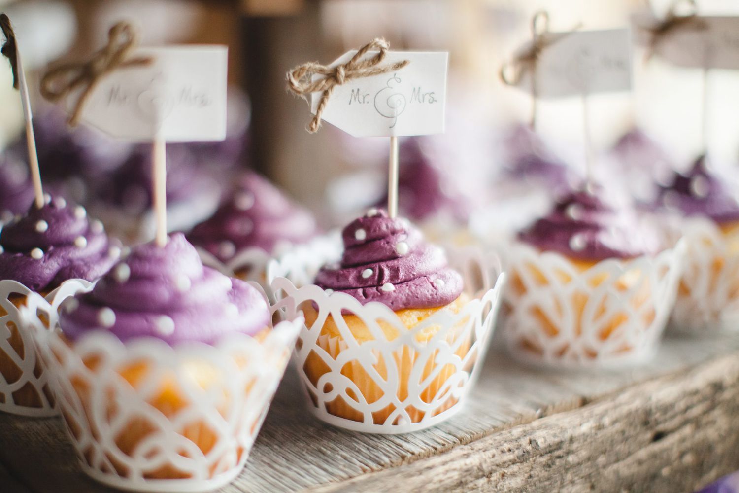 purple frosted cupcakes with white polka dot sprinkles