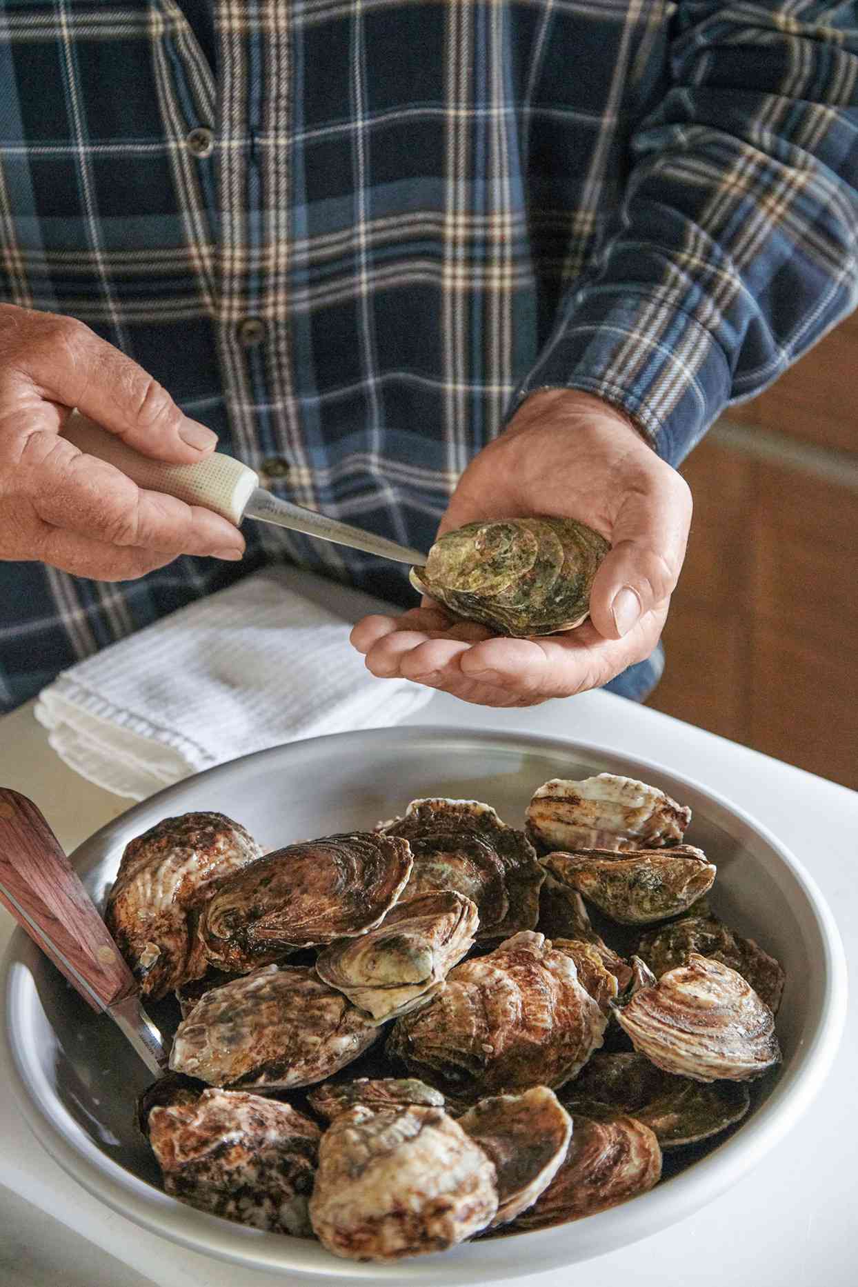 first step of shucking oyster