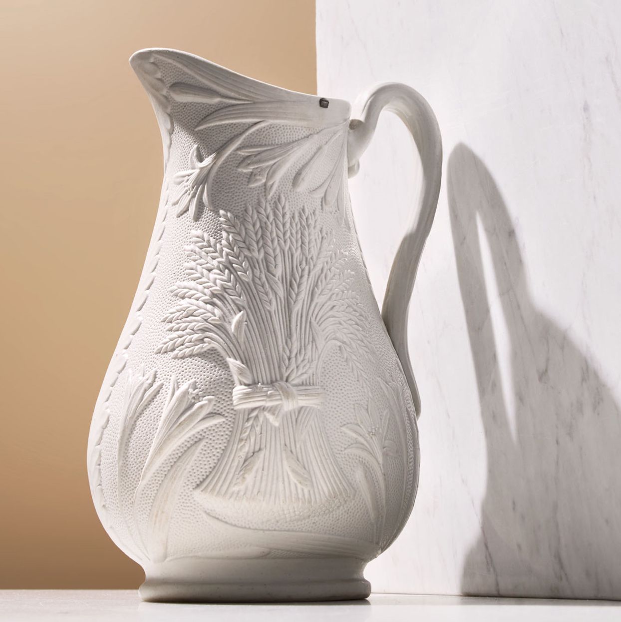white ceramic jug emblazoned with wheat