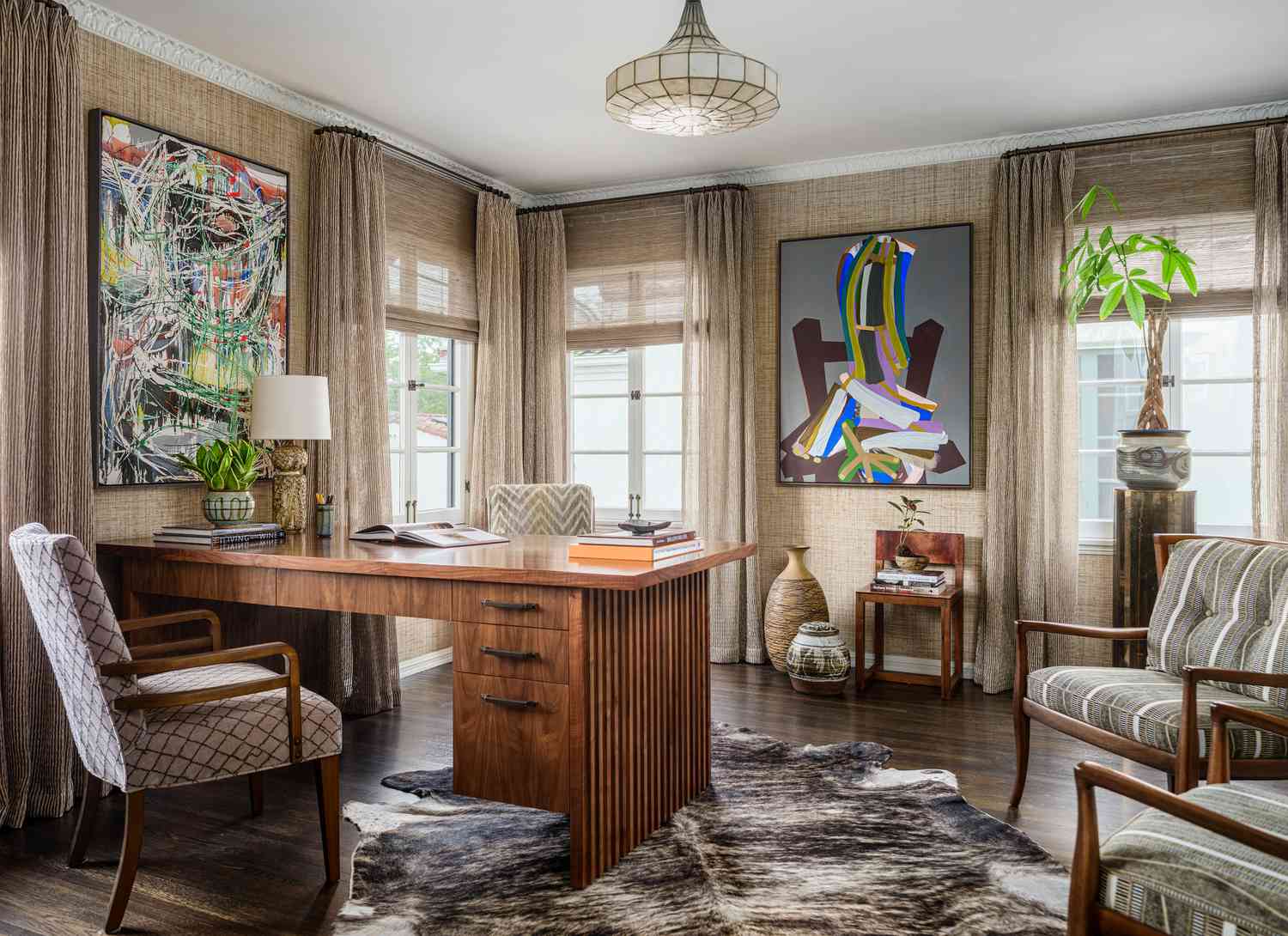 eclectic office with a desk and textured wallpaper
