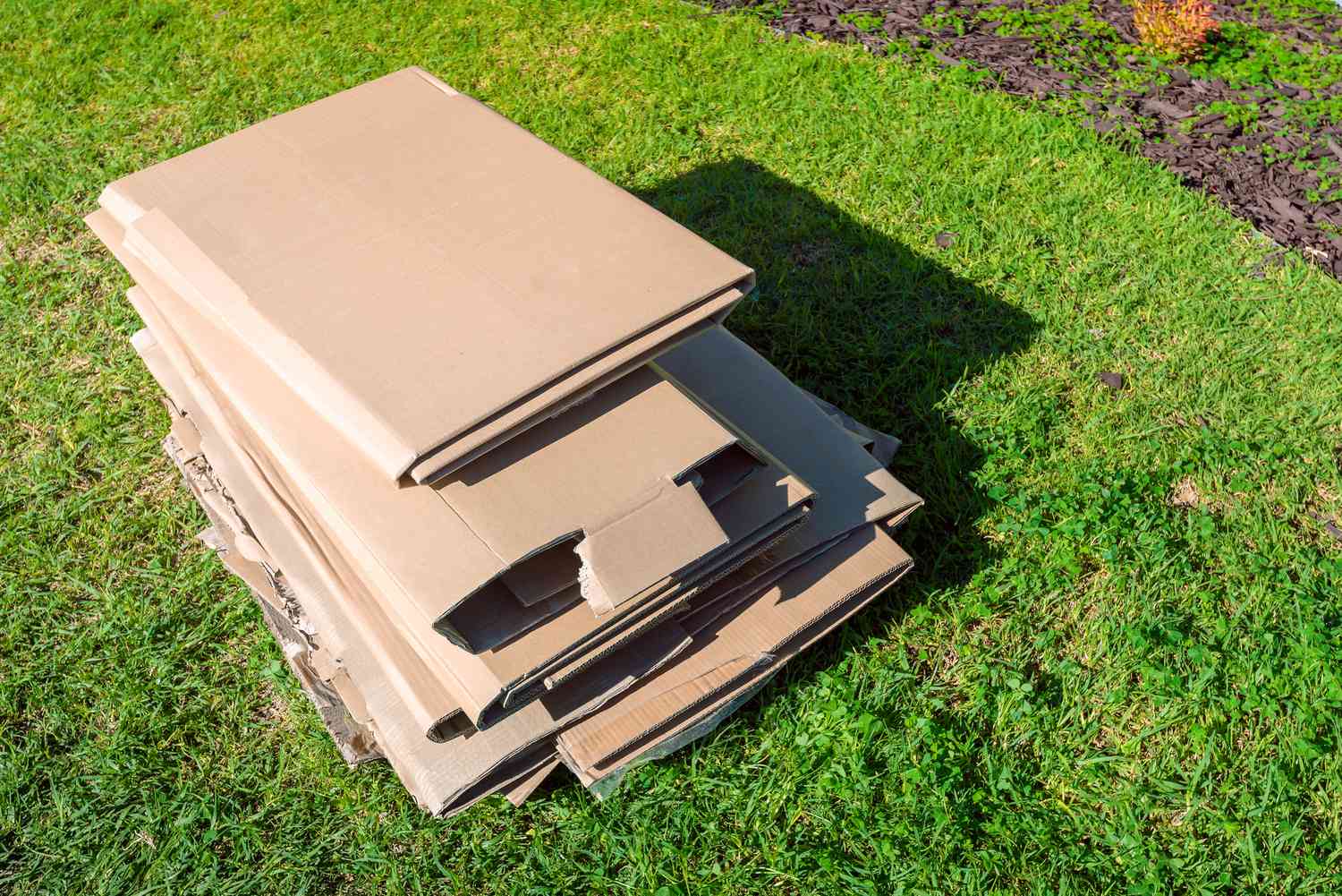 Pile of broken down cardboard in the garden