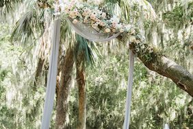 muted blue tulle hanging from tree