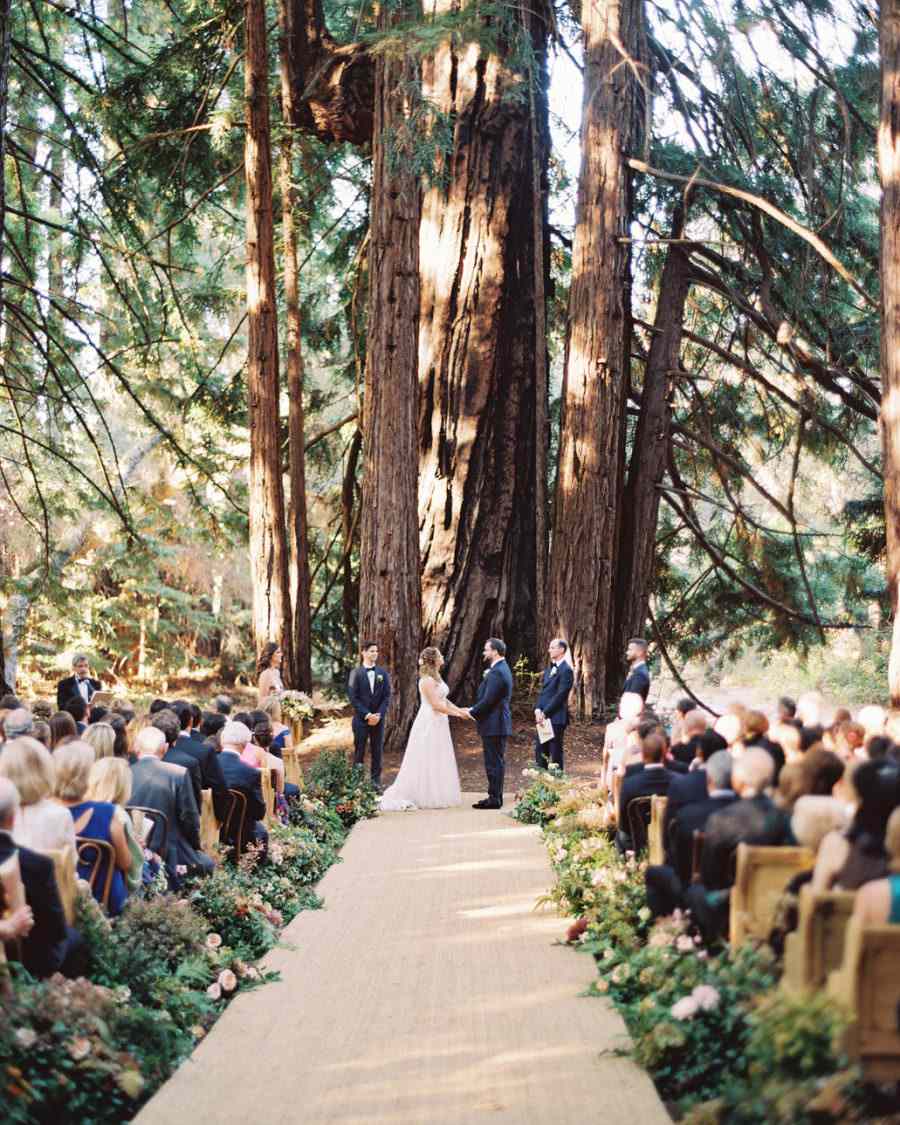 floral arrangement lined wedding aisle