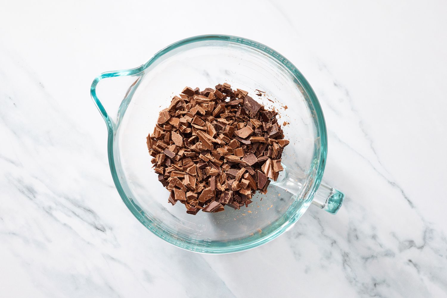 Chocolate bar chunks in measuring cup